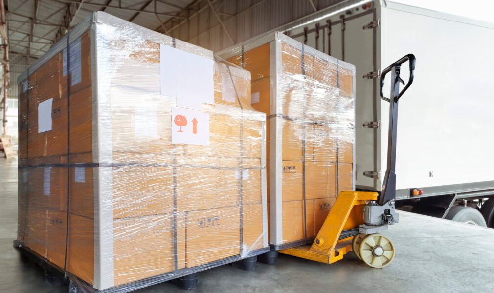 stacked-package-boxes-pallet-rack-waiting-load-into-shipping-container-cargo-shipment-boxes