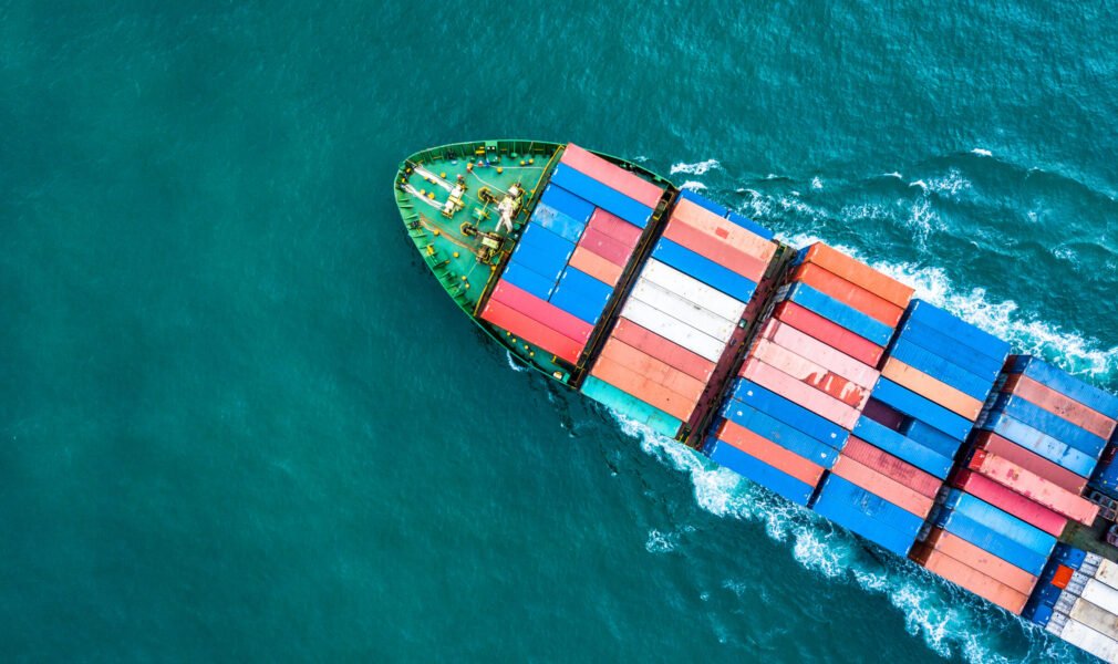 Aerial top view container cargo ship, Business logistic and transportation of International by ship in the open sea.